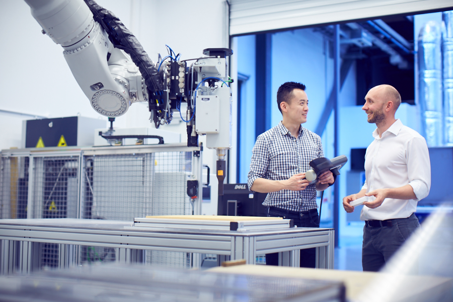 Two engineers discussing their work